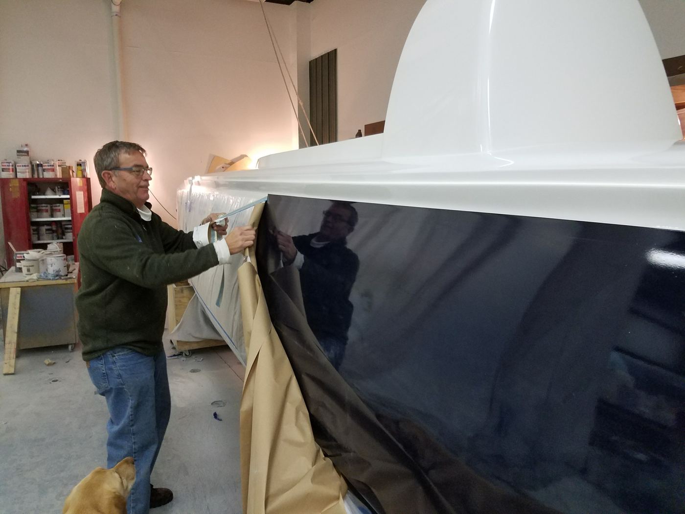 Peeling back the wrap on a finished part.