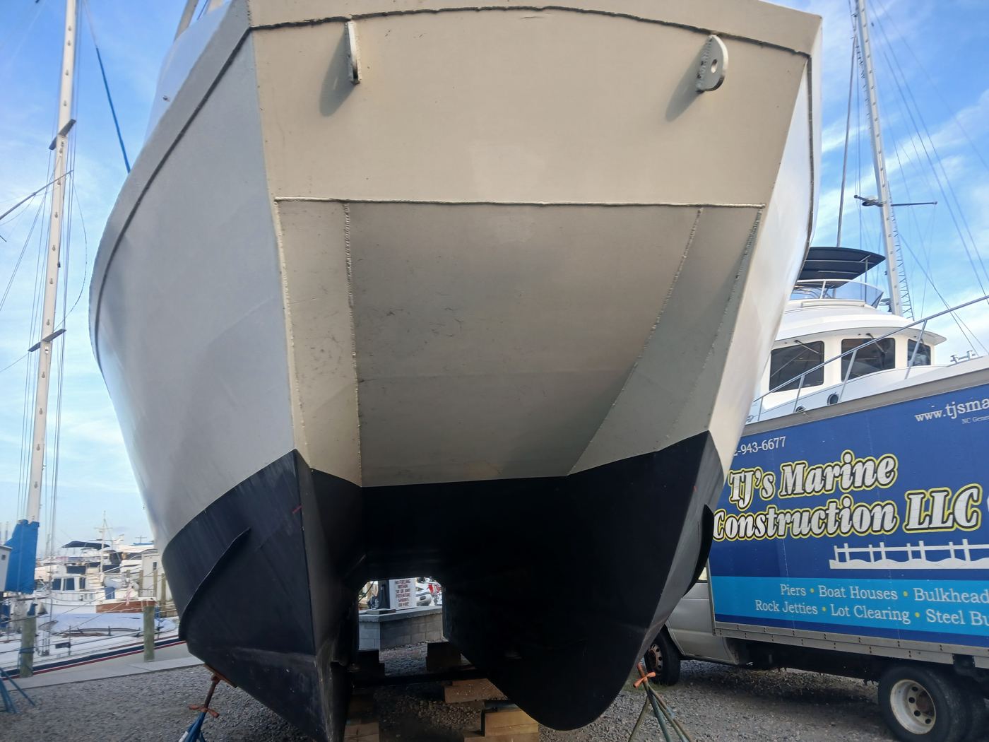 Looking up at her twin hulls from the bow.